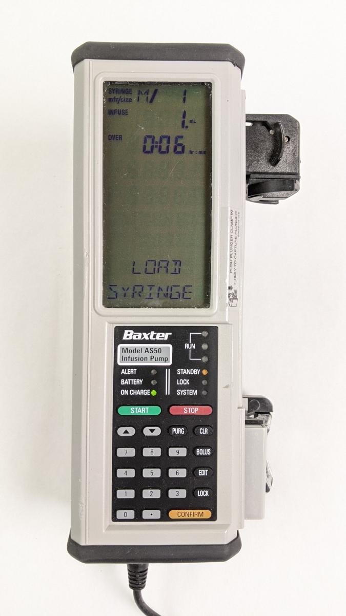 Baxter AS50 Infusion Pump with AC Adapter and Pole Clamp